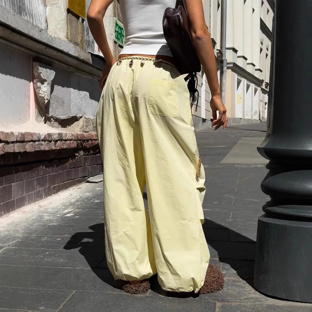 Women's polyester drawstring loose casual trousers in solid yellow colour on model