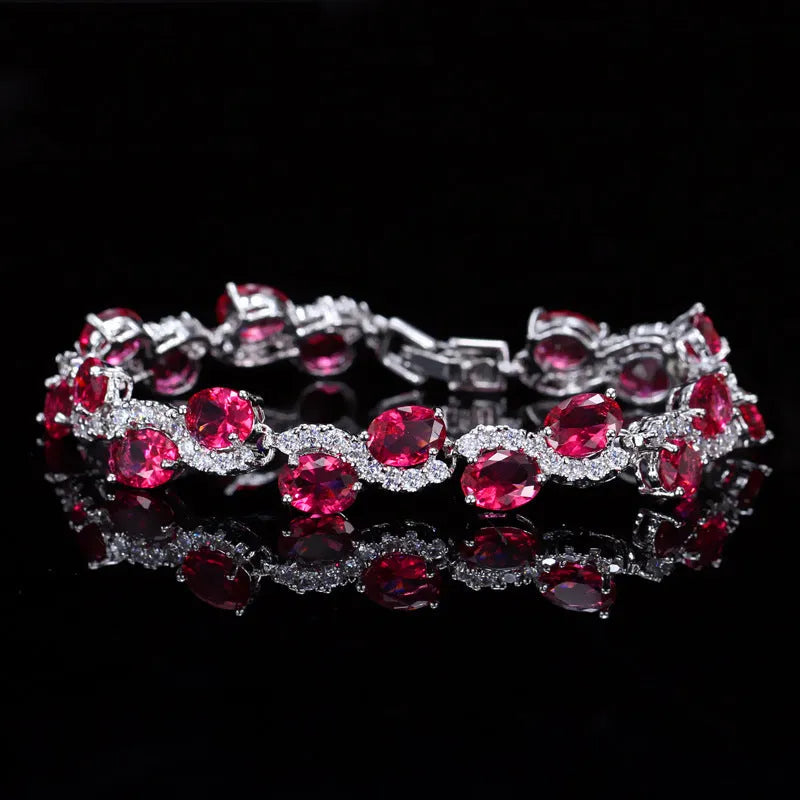 Copper-plated gold bracelet with zircon stones showing 18.4cm length and geometry design