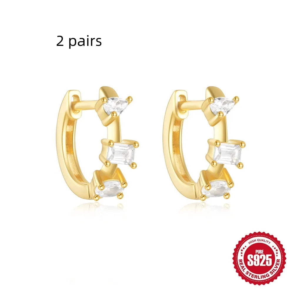 Sterling silver geometric stud earrings with small round designs in gold or silver electroplated finishes