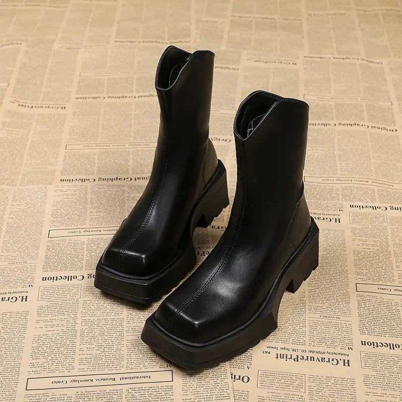 Black women's platform Martin boots with a square toe, high heel, and back zip.