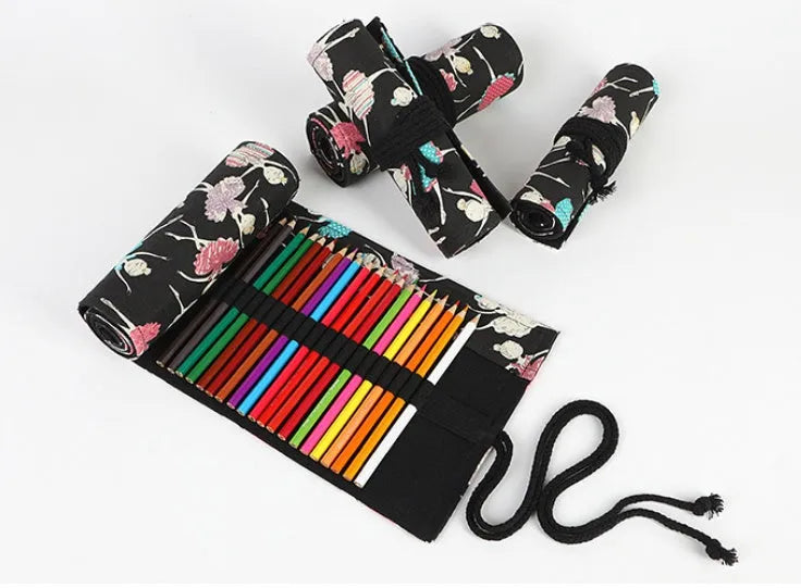 Square canvas pencil case with ballet girl print, showing multiple holes for storing sketching pencils and colour leads.