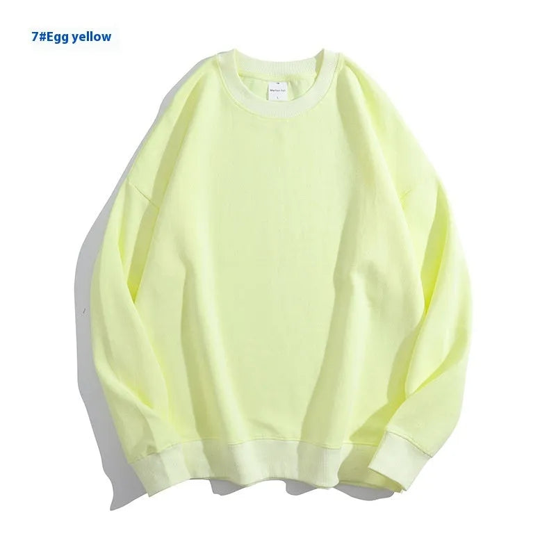 A loose round neck off shoulder pullover sweater in a solid colour, with long sleeves.