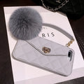 Soft plush hairball phone case for iPhone in dark green grid pattern.
