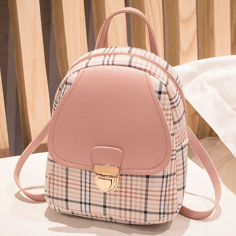 Diagonal shoulder phone bag in PU material showing adjustable strap and handheld carry option