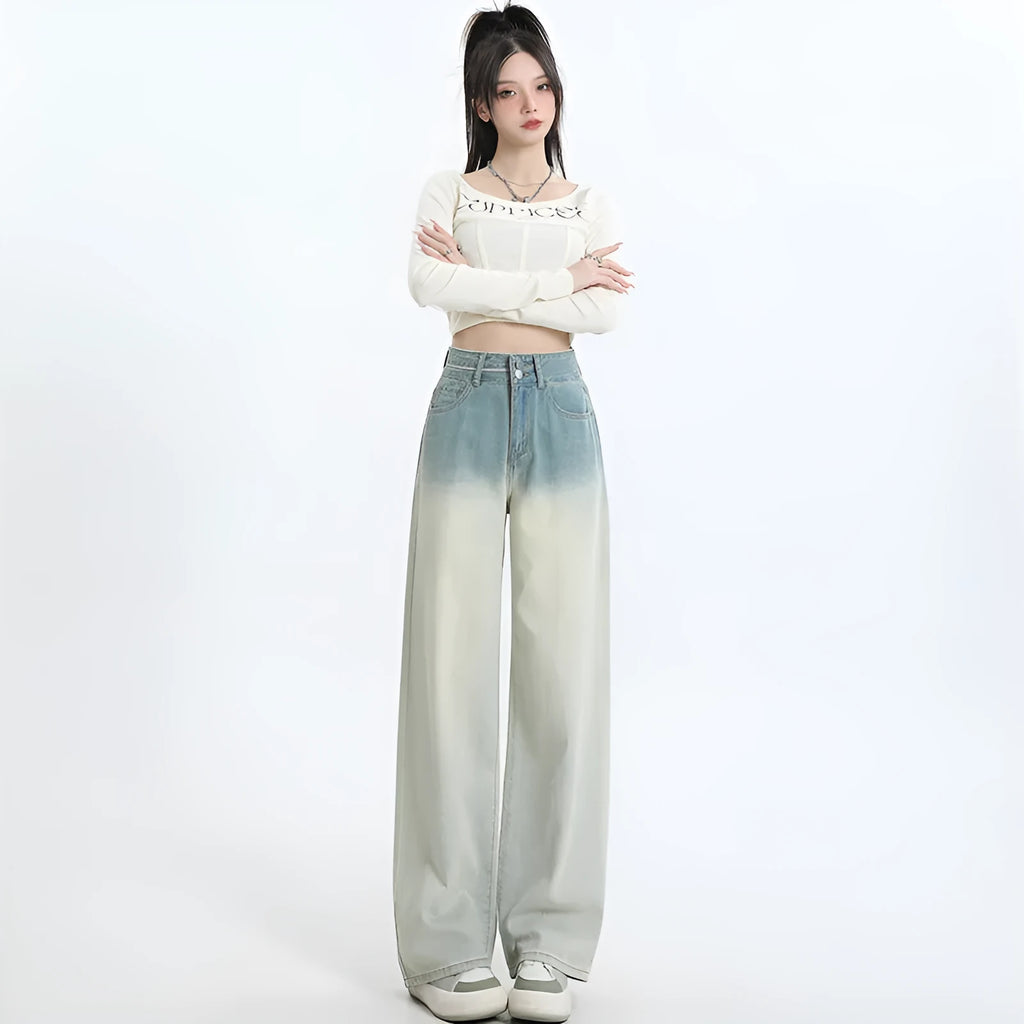 Women's gradient blue straight-leg denim trousers on a model, showing the ombré colour effect.
