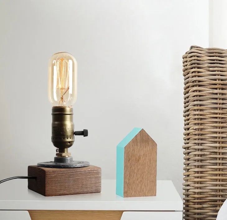 Wood and iron water pipe table lamp measuring 9cm wide by 13cm high with E26/E27 socket