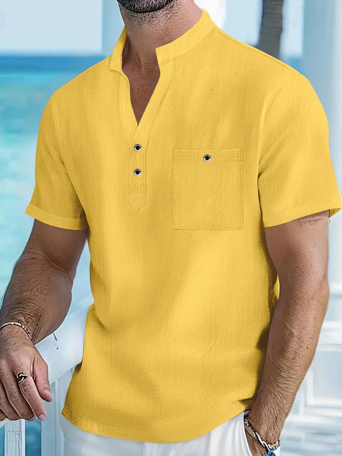 Man wearing a light-coloured linen stand collar short sleeve t-shirt in a relaxed fit.