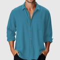 Man wearing a loose-fit, long-sleeve polyester beach shirt with a stand collar