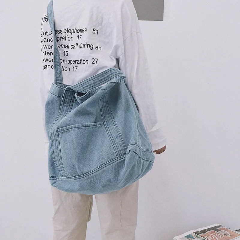 Large canvas denim tote bag in dark blue with polyester lining and horizontal square shape