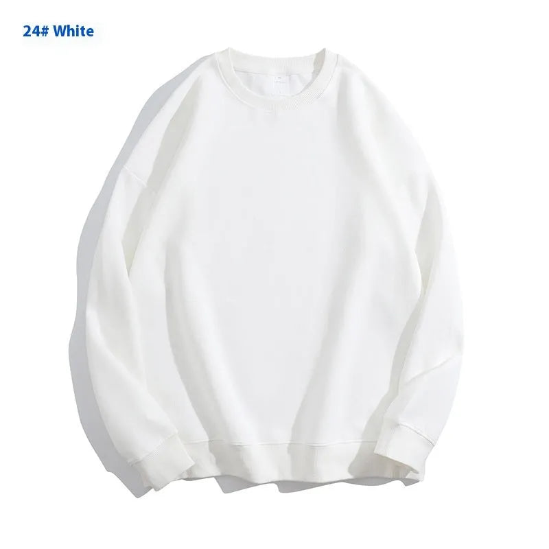 A loose round neck off shoulder pullover sweater in a solid colour, with long sleeves.