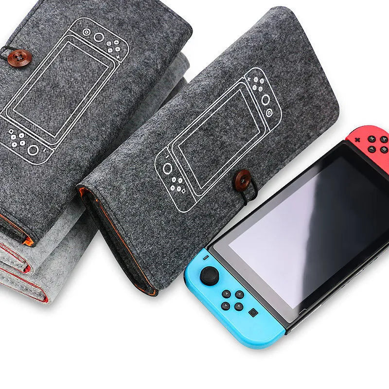 Black felt pouch for Nintendo Switch open to show console compartment and five game card slots