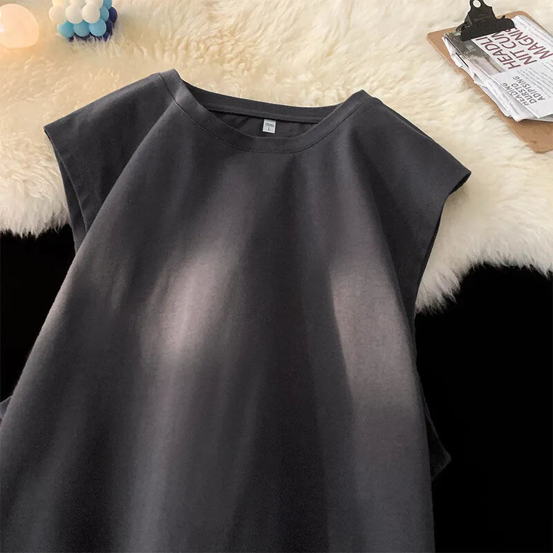 Men's solid colour loose fit cotton tank top on a hanger, showing straight hem and sleeveless design.