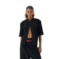Handmade black half-sleeve hunting shirt with a shirt collar on a mannequin