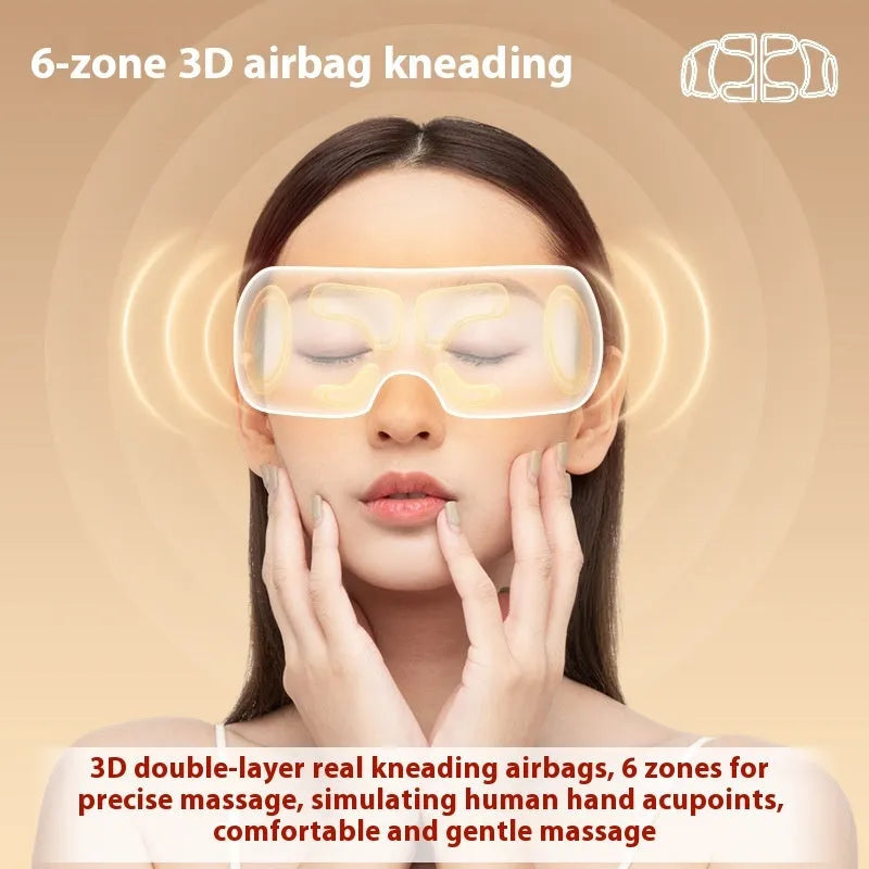 White rechargeable eye massager with airbag massage and hot compress functions showing compact design