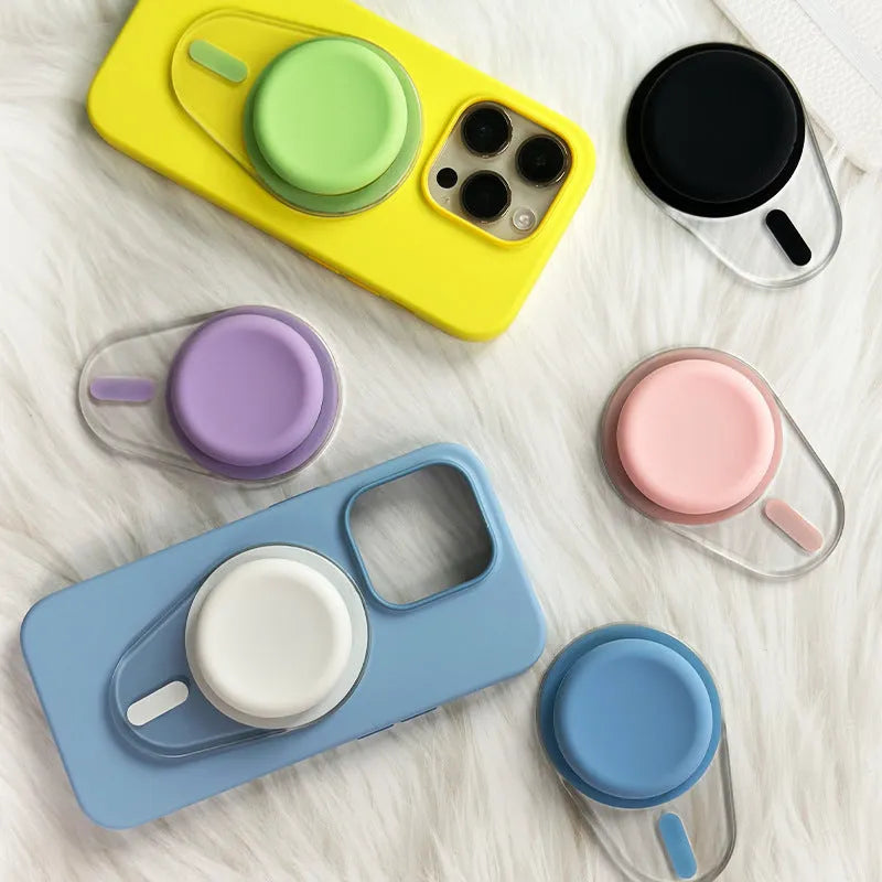 Magnetic suction telescopic folding phone bracket in white colour on desktop