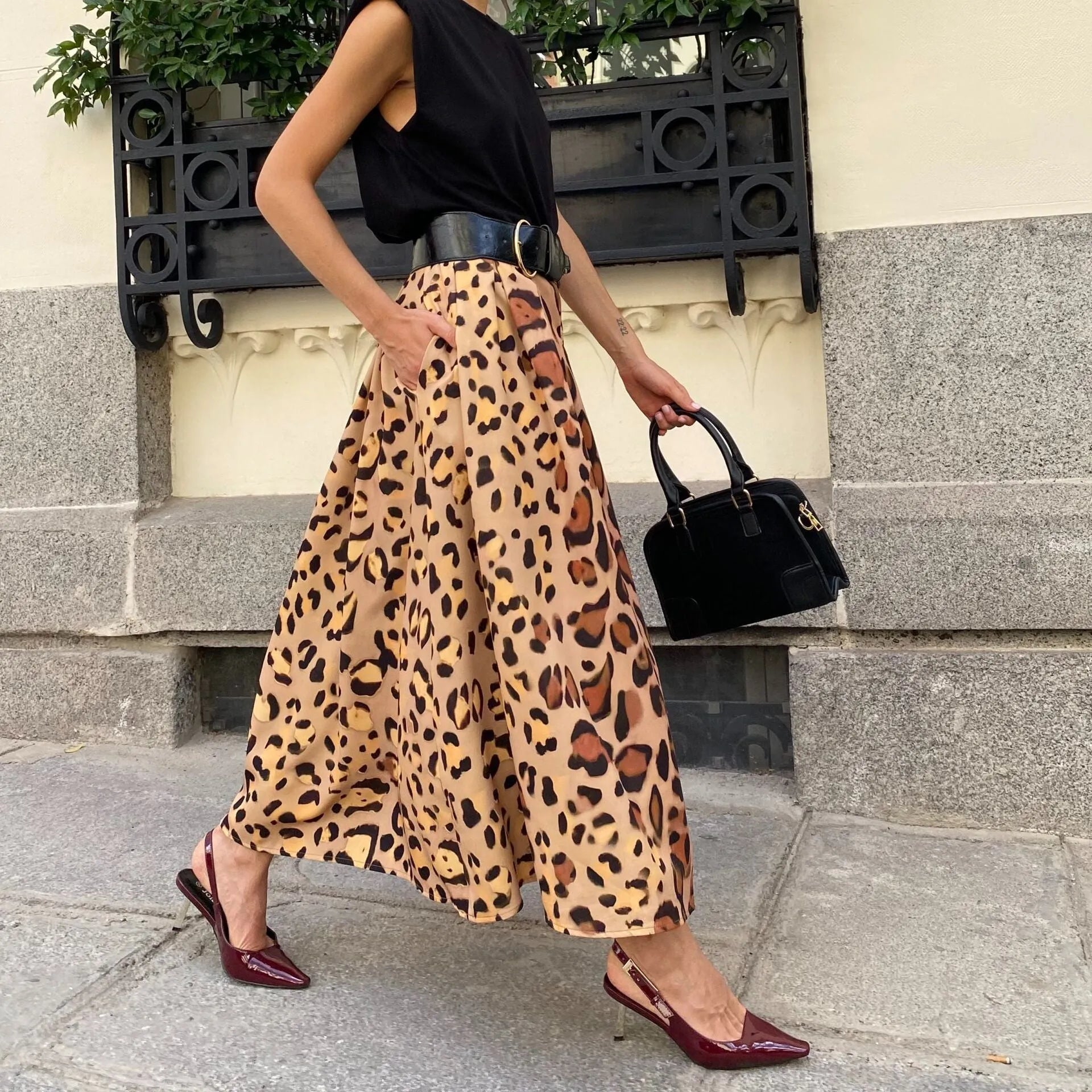 Brown leopard print women's A-line long skirt with big hem and structured polyester fabric