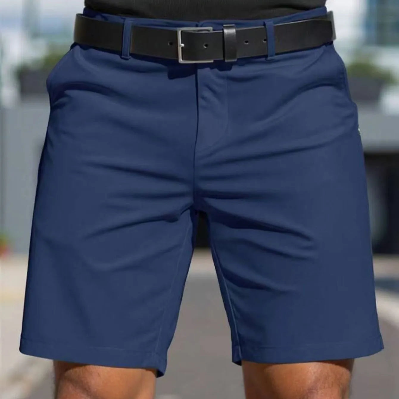 Man wearing straight-leg micro-elastic polyester fifth pants shorts in a choice of nine colours.