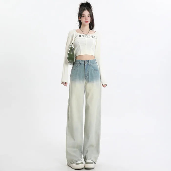 Women's gradient blue straight-leg denim trousers on a model, showing the ombré colour effect.