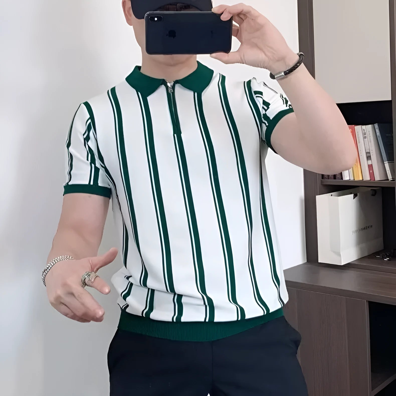 Man wearing a black Korean-style casual T-shirt with vintage stripes, cartoon graphics, and a decorative zipper detail.