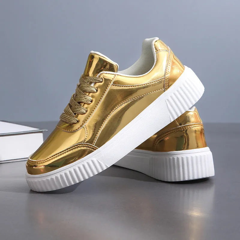 Rose gold sequinned platform sneakers with round toe and thick sole on a white background