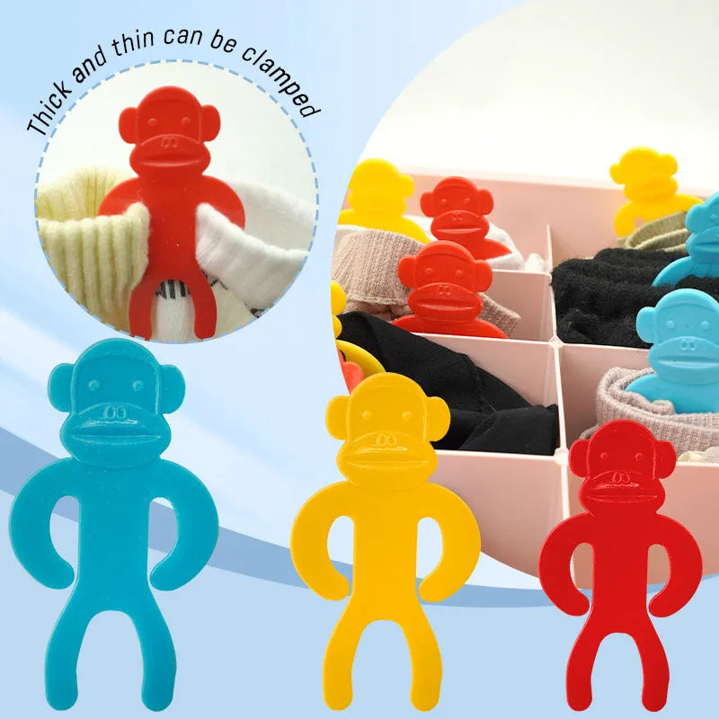 Plastic socks storage clips in blue, yellow and red colours for keeping sock pairs together during machine washing