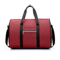 Medium-sized cylinder travel bag in Oxford cloth, shown in one of four colours: black, blue, light grey or red.