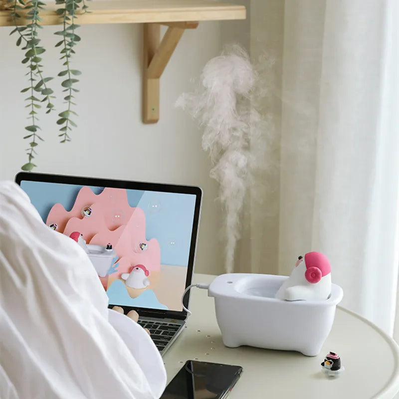 White USB air humidifier with 550ml water tank and adjustable mist settings for desk use