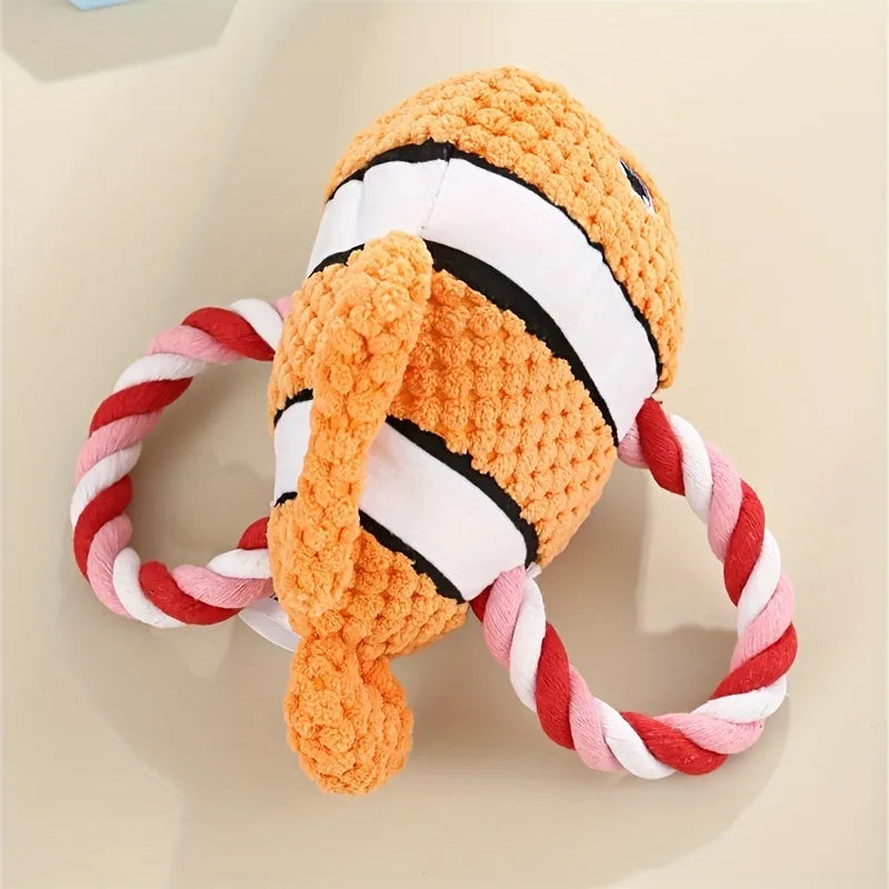 Grey, green, and orange turtle-shaped plush dog chew toy with knotted texture