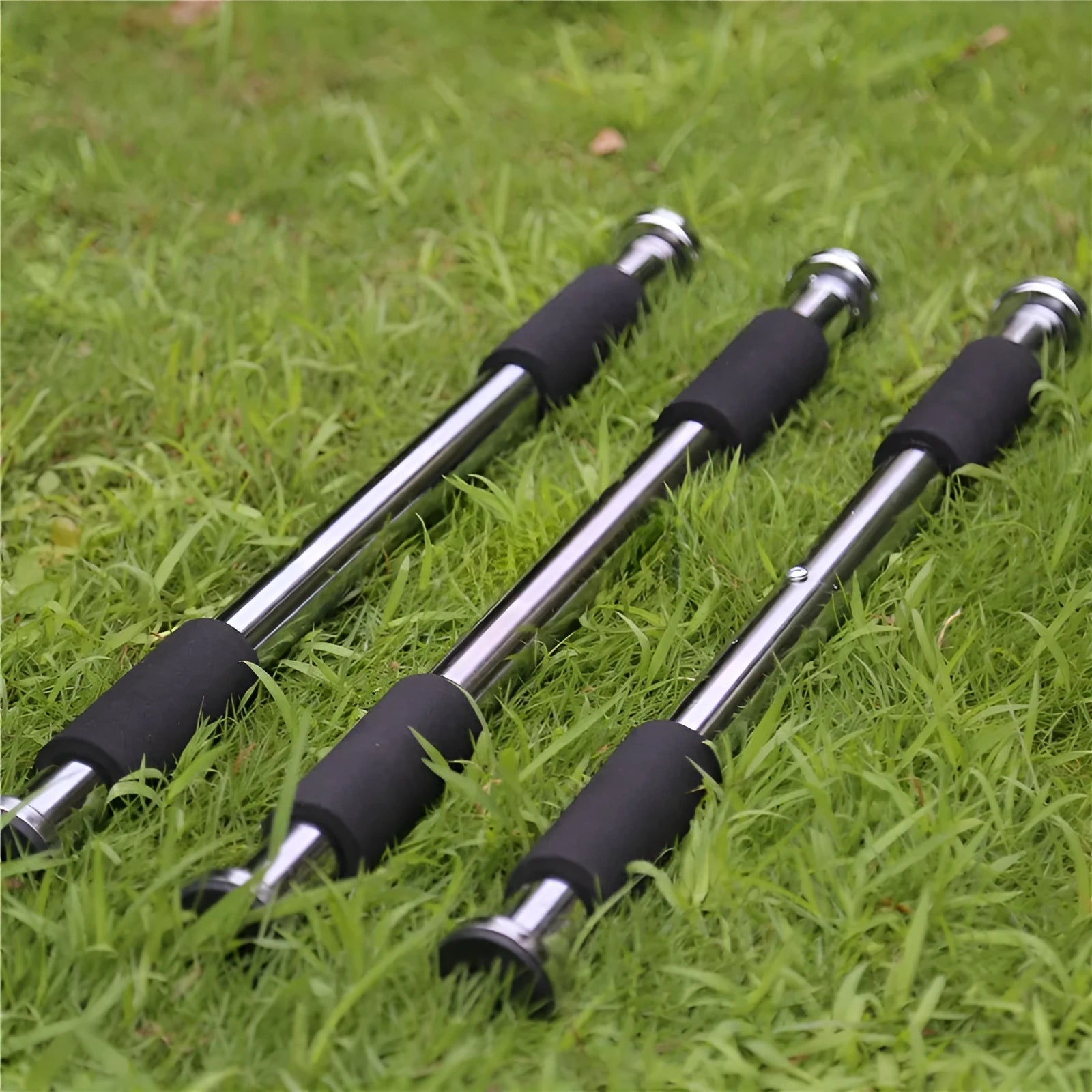 Steel adjustable pull-up bar extended for doorframe installation, showing parallel grips.