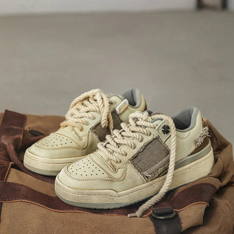 Beige vintage low-top skateboard shoes with round toe and lace-up front