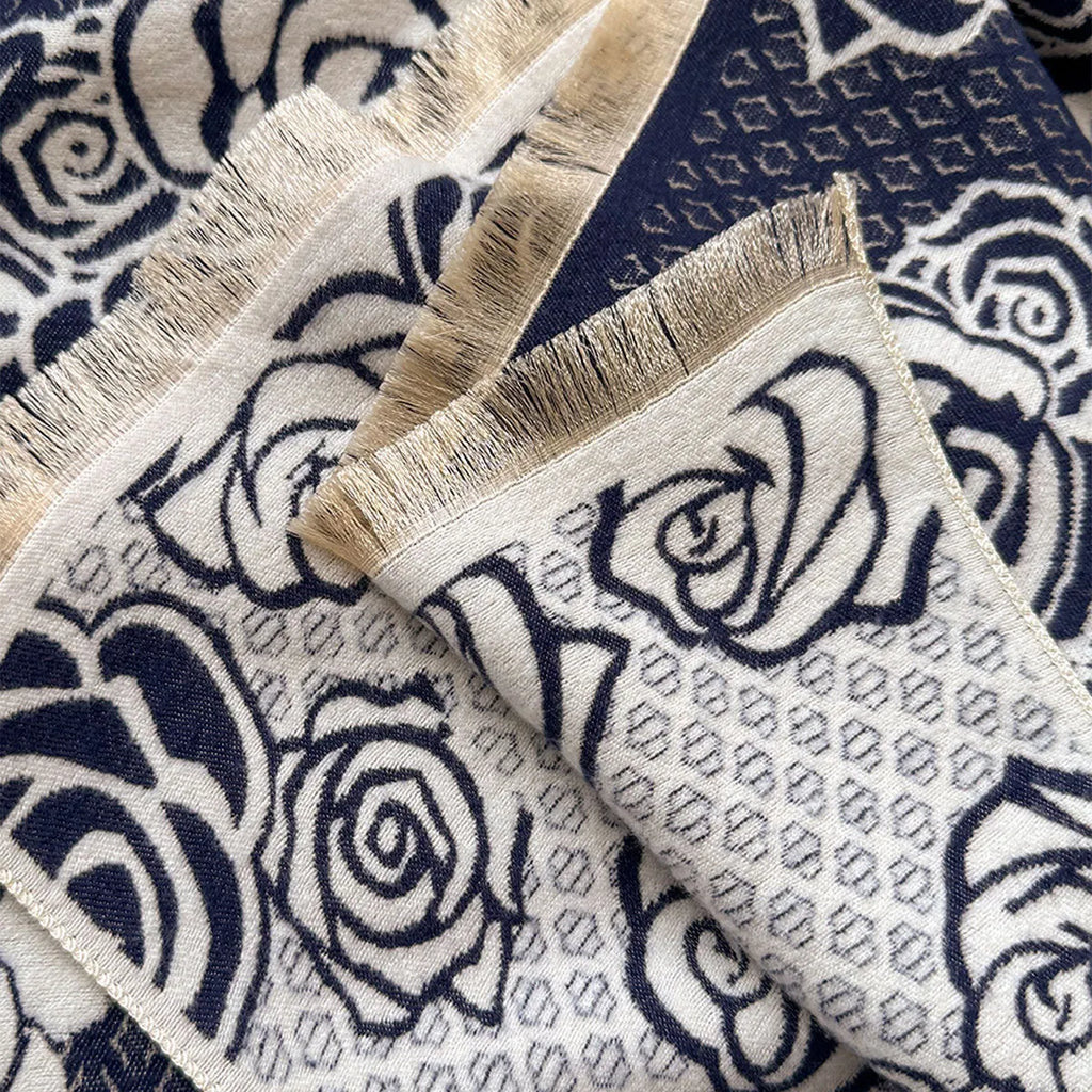 Grey imitation cashmere winter scarf with tassels laid flat, showing its long rectangular shape.