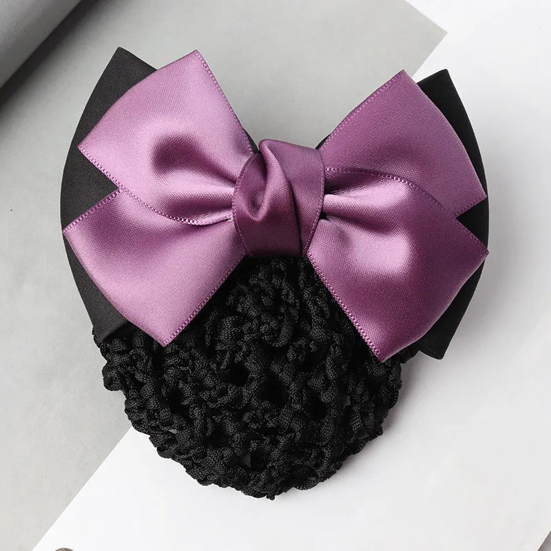 Professional flower bow headdress hair clip ornament on a work plate, shown in a selection of net and mesh colour variations.