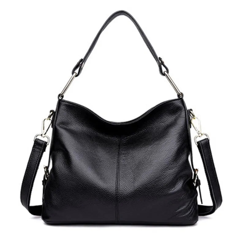 Genuine leather women's crossbody bag in square vertical design, showing internal zipped phone and document pockets.