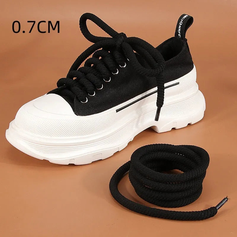 Pair of round woven shoelaces in white next to a ruler showing 10mm diameter and length scale.