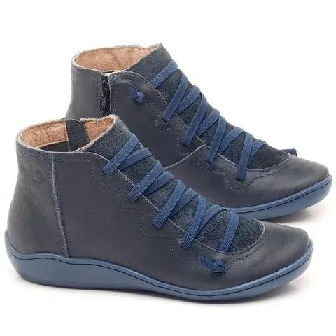 Women's flat wedge heel ankle booties in various colours including leopard print, with round toe and rubber sole.