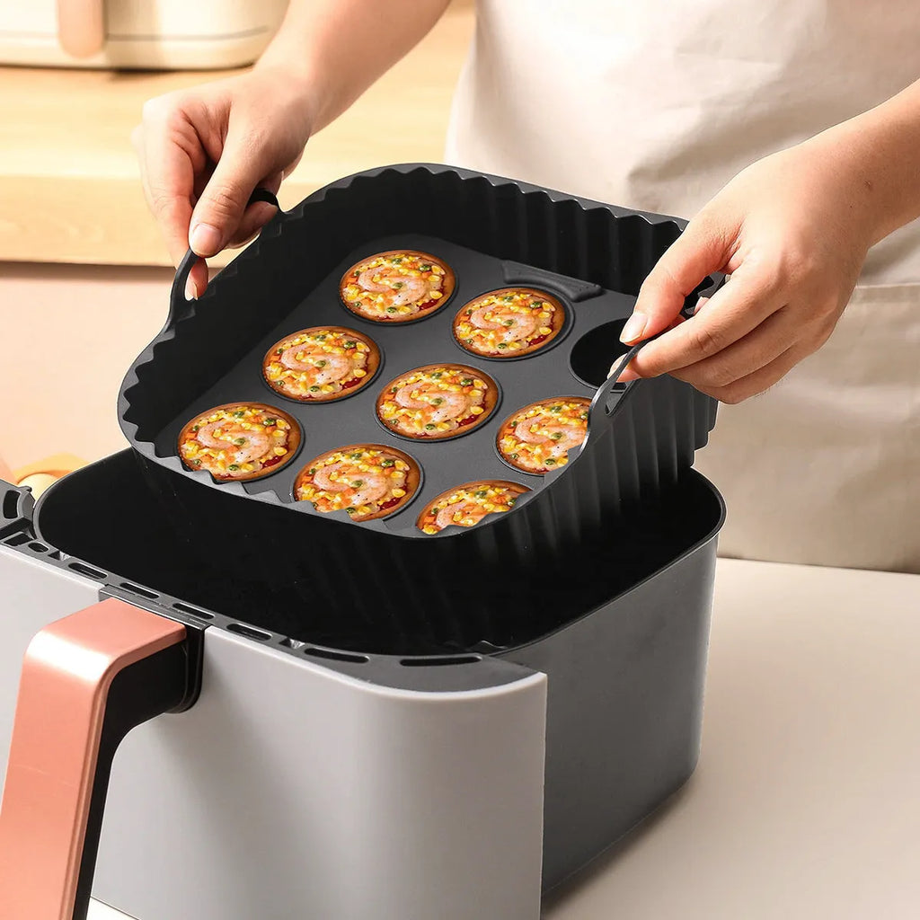 Black silicone baking tray set for air fryer including 4 square trays for cake, jelly, and pudding baking.