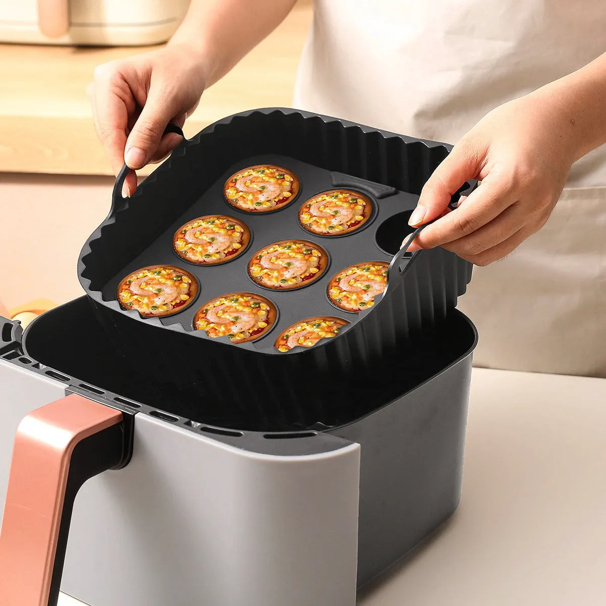 Black silicone baking tray set for air fryer including 4 square trays for cake, jelly, and pudding baking.