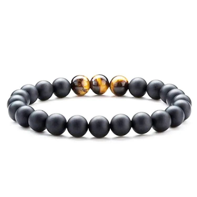 A pair of matte black agate bead bracelets with geometric design for him and her.