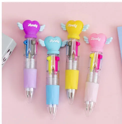 A four-colour ballpoint pen with a press top and a colourful cartoon silicone grip, showing one of five random designs.