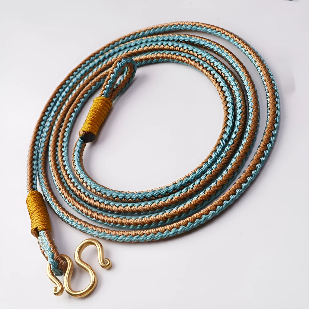 Gold peace buckle choker necklace with intricate mixed gemstone inlaid pendant on a model.
