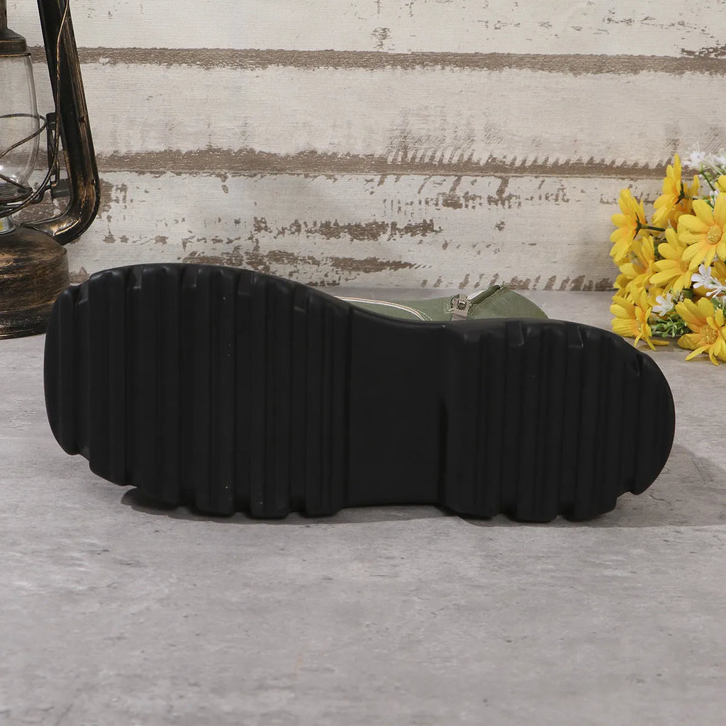 Women's black retro platform boots with patchwork design, chunky heel, and side zipper.