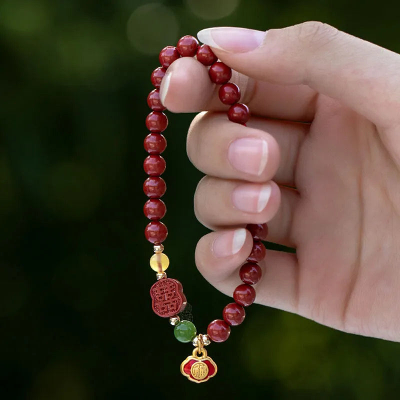Cinnabar bracelet with fu character in Emperor Sandstone colour, showing 6mm and 8mm bead size options.