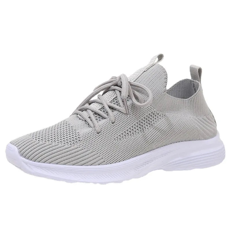 Women's mesh running shoes in creamy white with flyknit upper and English muffin heel detail