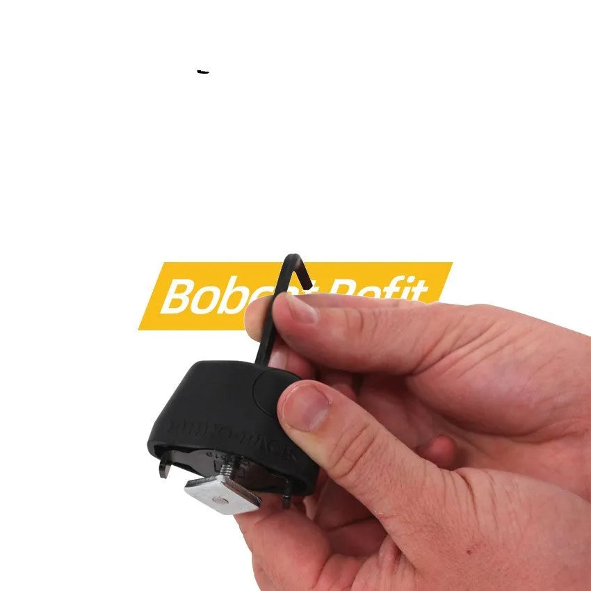 Roof platform steel cable lock with plastic sheath securing a kayak to roof bars.