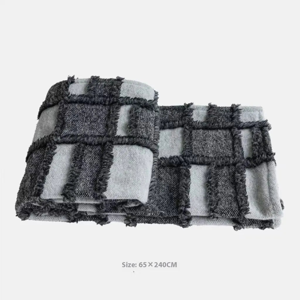 Modern minimalist bed runner nap blanket set with grey and white plaid pattern on bed