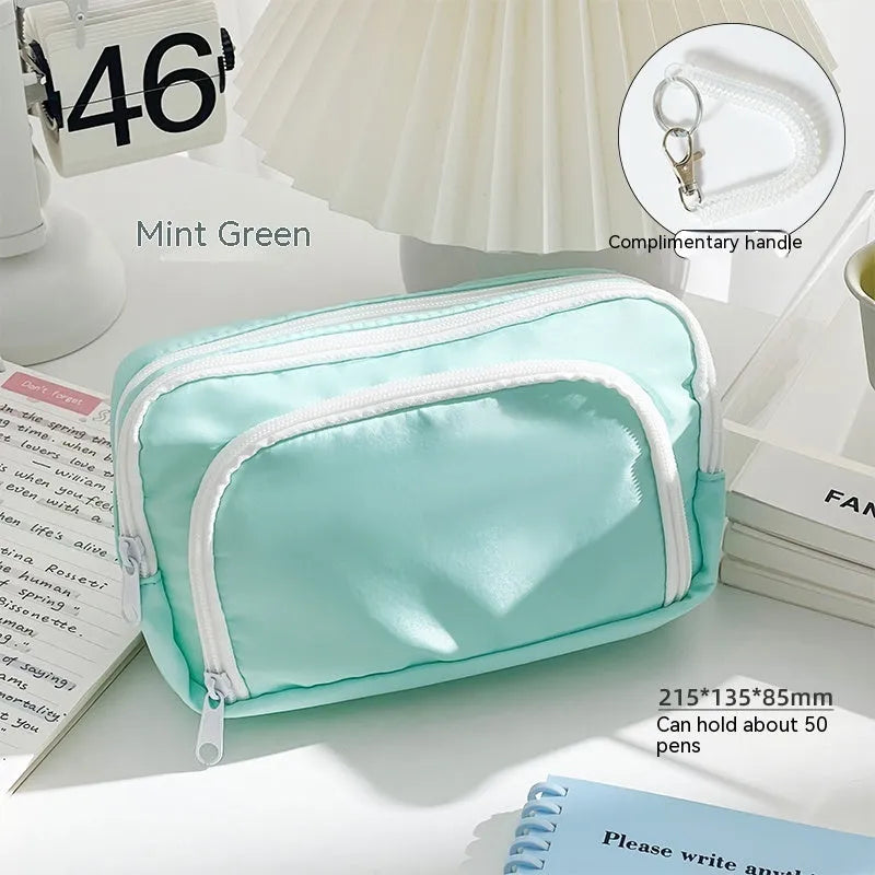 Double layer pencil case in blue, pink, cream, or green with gift handle, dimensions 215x135x85mm