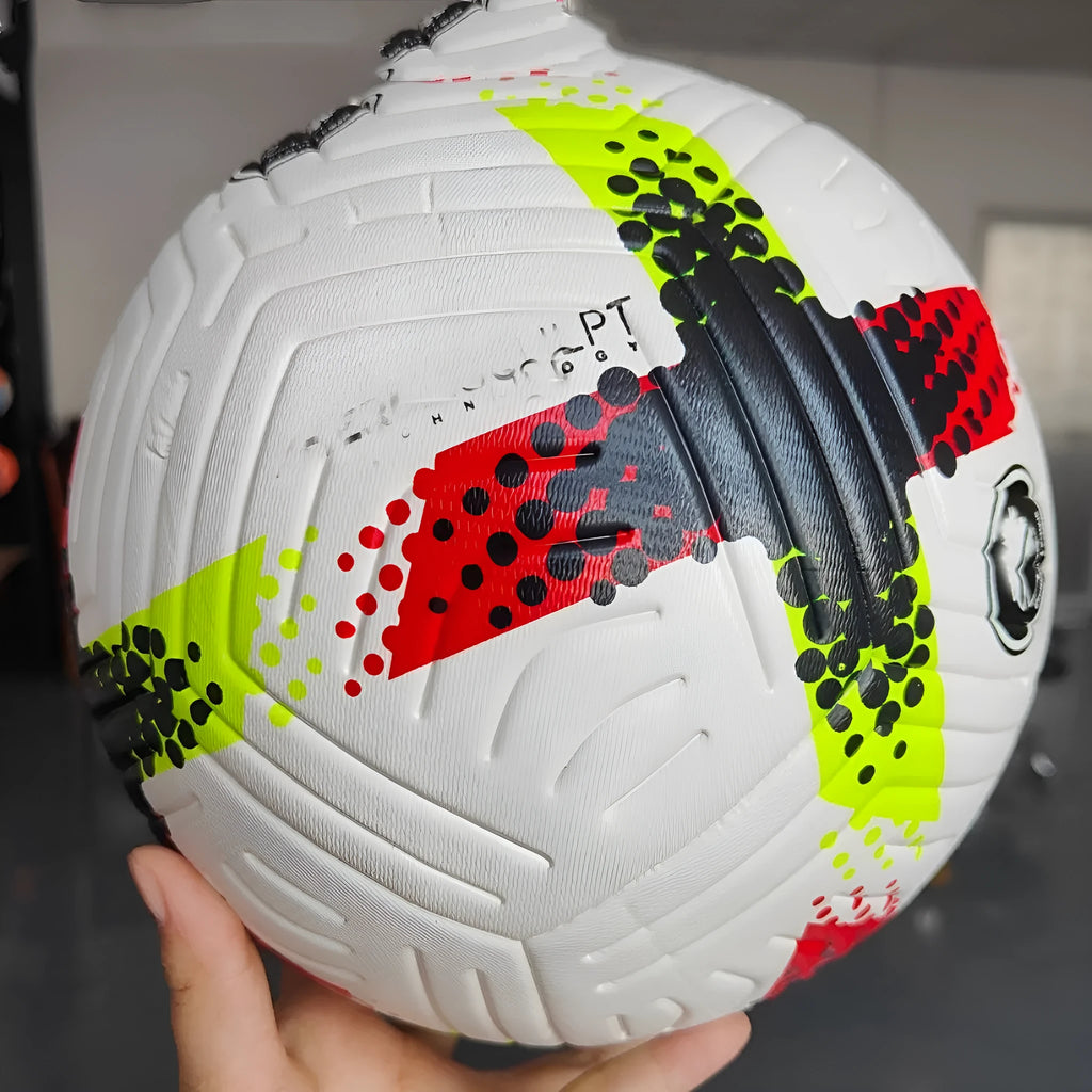 Fluorescent green size 5 PU football on a sports field