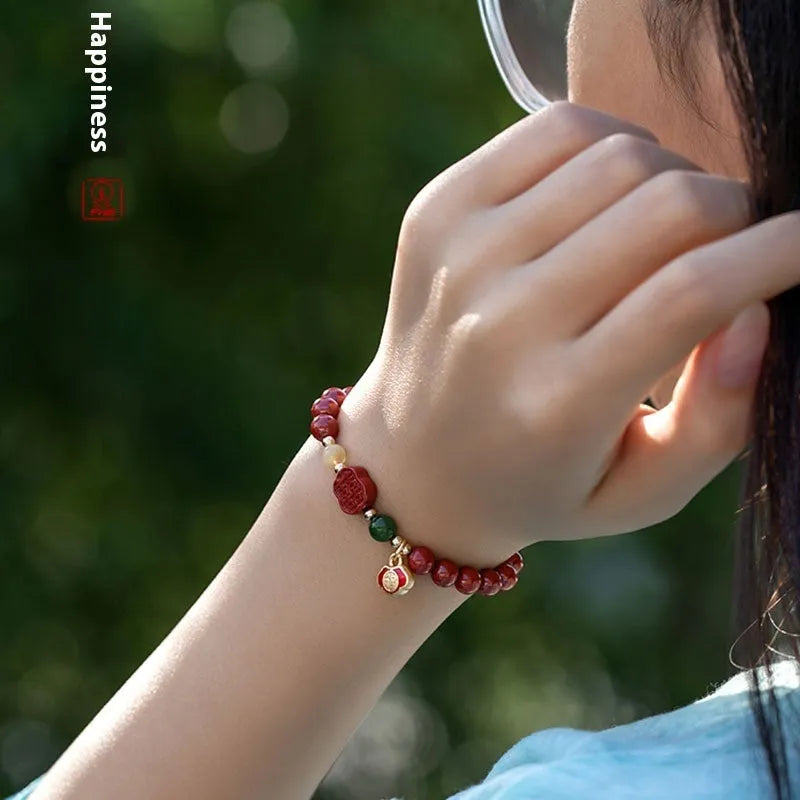 Cinnabar bracelet with fu character in Emperor Sandstone colour, showing 6mm and 8mm bead size options.