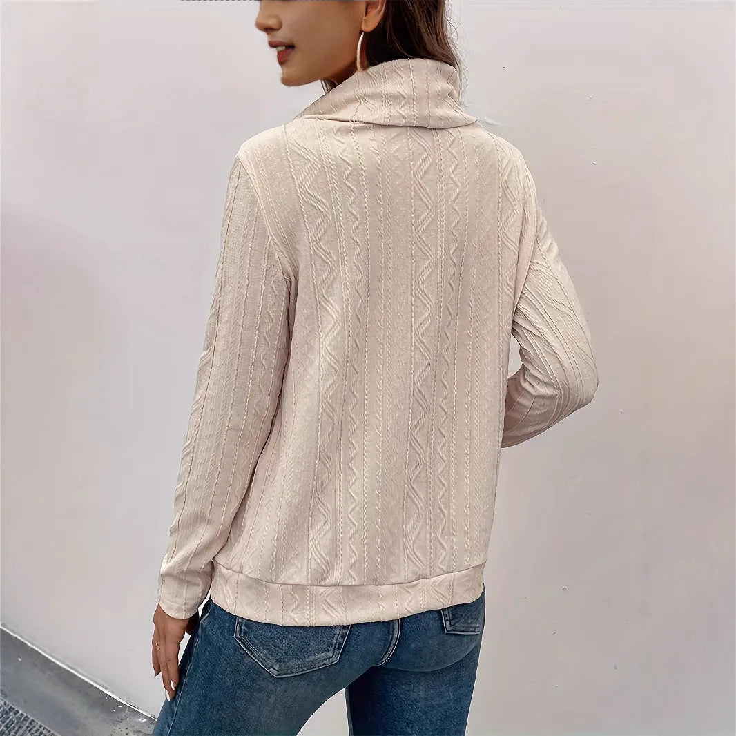 Apricot coloured hooded pullover sweater with drawstring and long sleeves laid flat