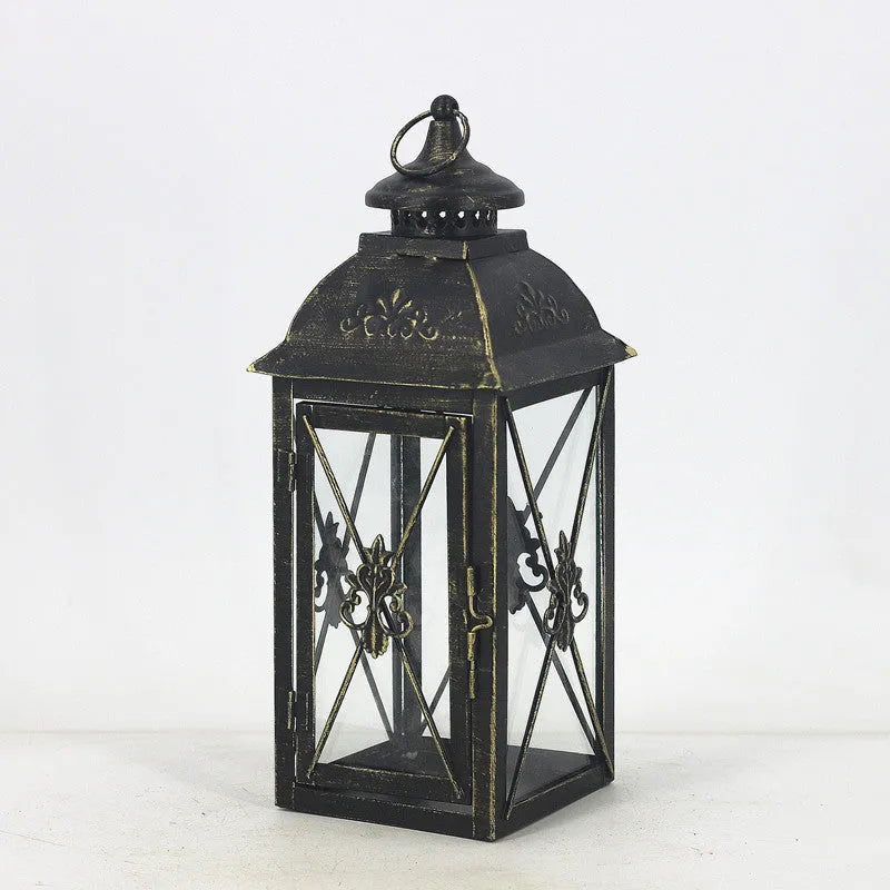 Black and white wrought iron floor-standing storm lantern with tempered glass panels for courtyard use